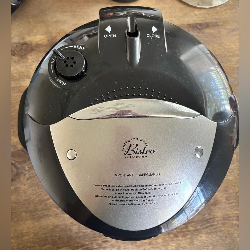 Black Wolfgang Puck® 7 Qt. Automatic Mechanical Pressure Cooker